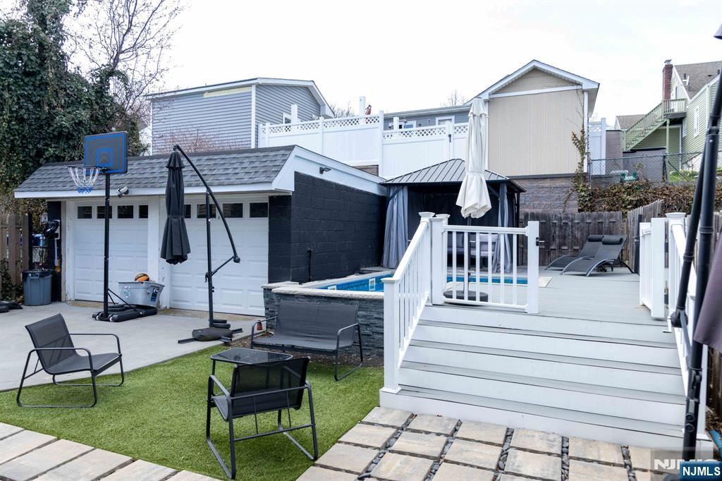 126 Ridge Avenue Bloomfield, NJ 07003 - Photo 41 of 45 a view of a chair and tables in the patio of the house