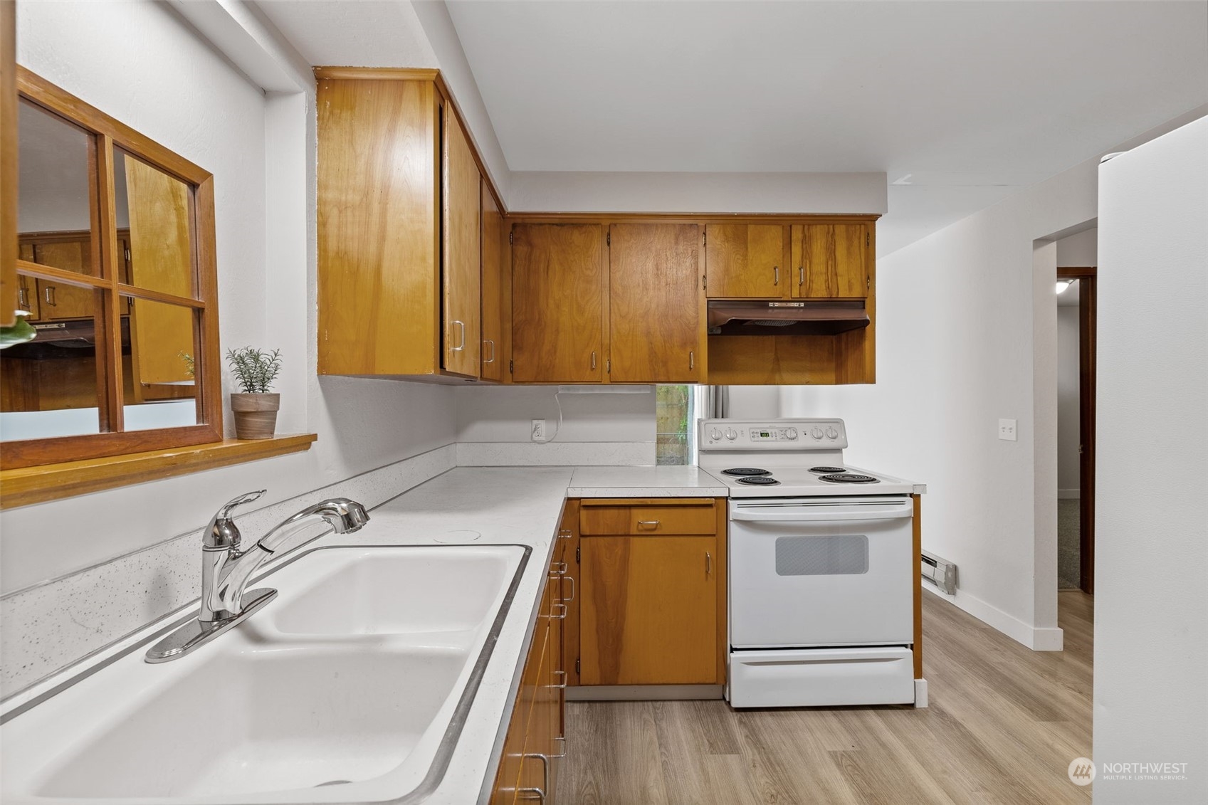 17 Fern Road Everett, WA 98203 - Photo 11 of 24 a kitchen with a sink stove and cabinets