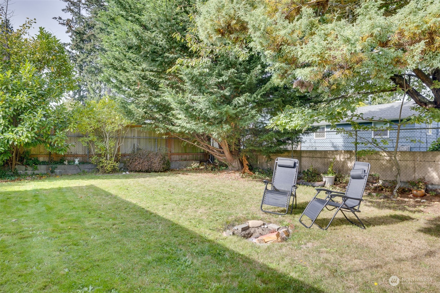17 Fern Road Everett, WA 98203 - Photo 24 of 24 a view of backyard with slide and trees