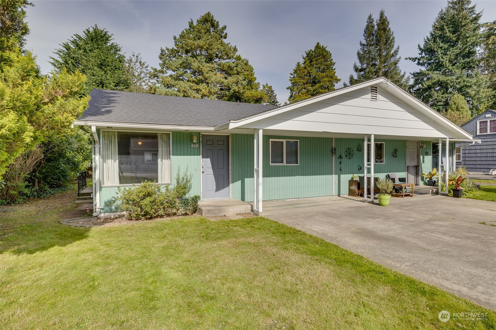 17 Fern Road Everett, WA 98203 - Photo 4 of 24 a view of a house with a yard and potted plants