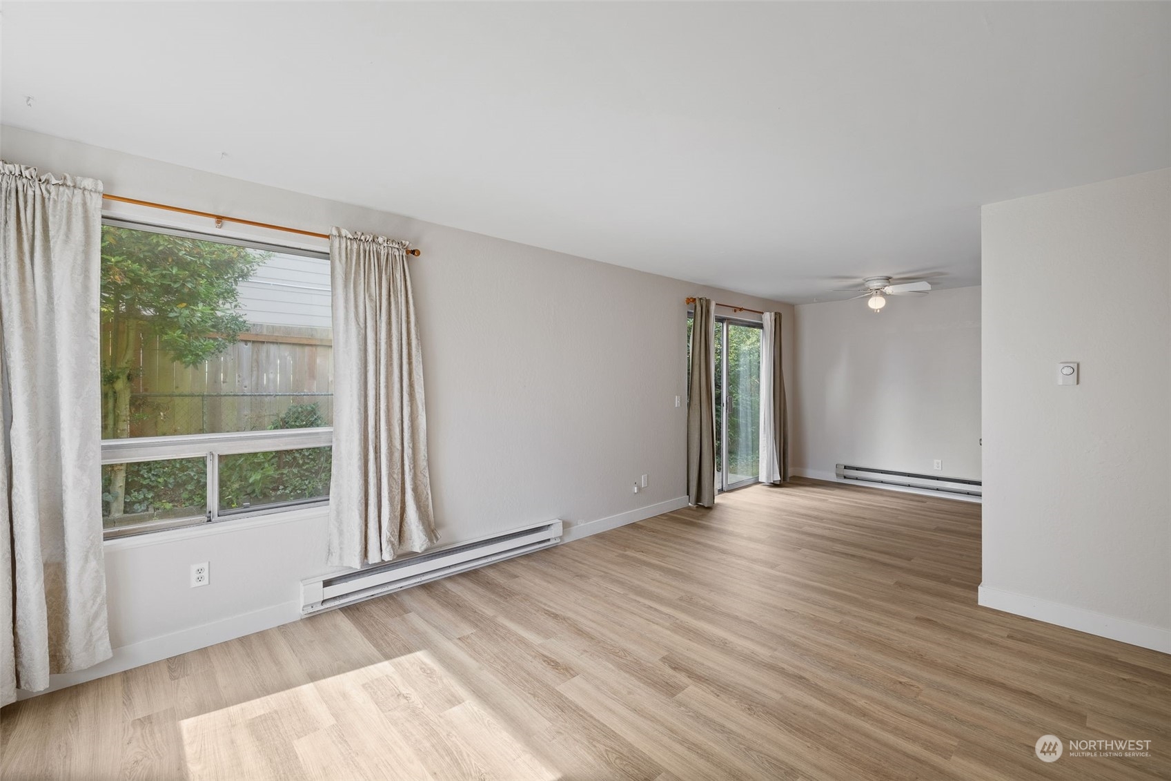 17 Fern Road Everett, WA 98203 - Photo 5 of 24 a view of an empty room with wooden floor and a window