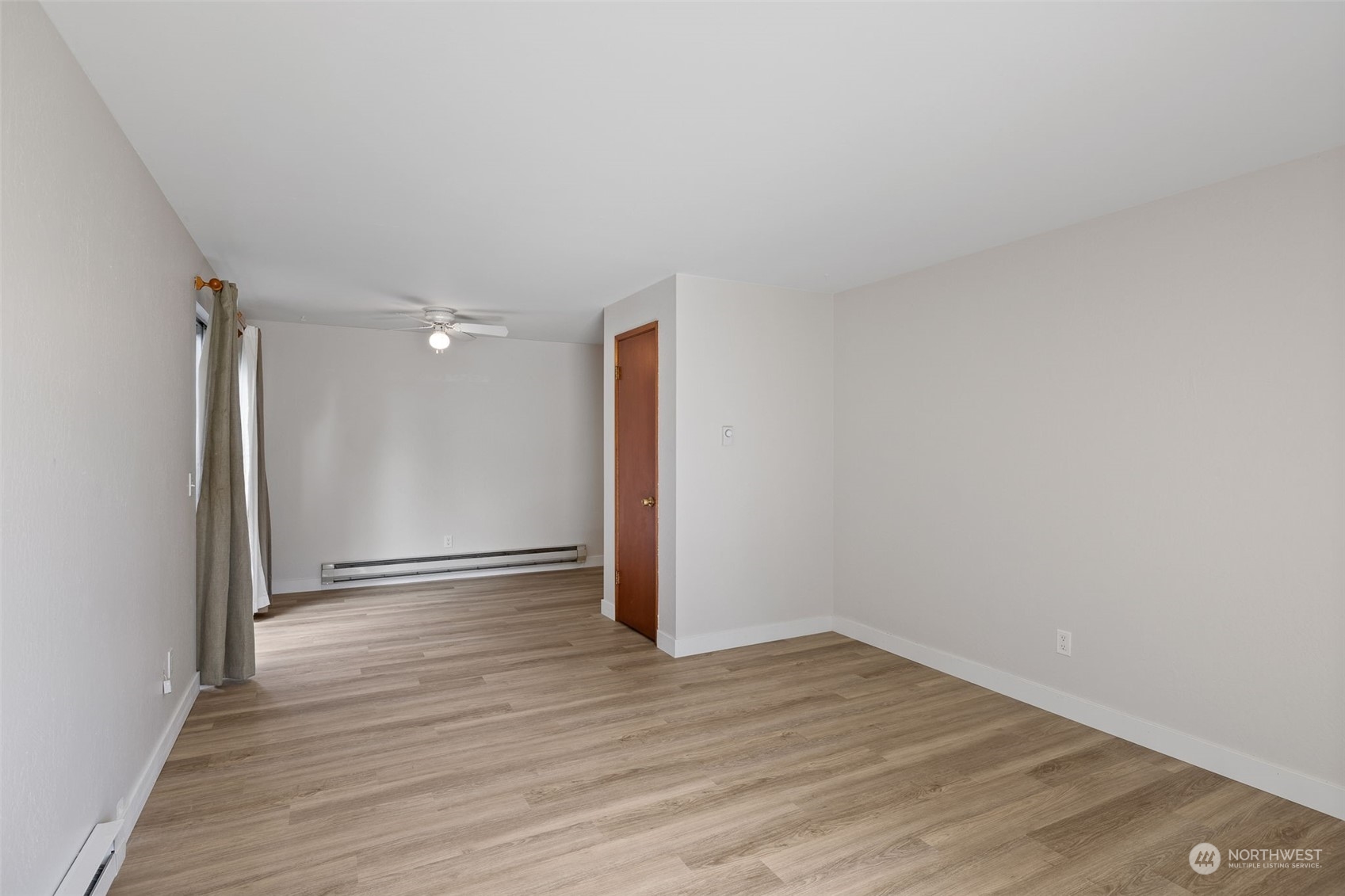 17 Fern Road Everett, WA 98203 - Photo 6 of 24 a view of an empty room with wooden floor and a window