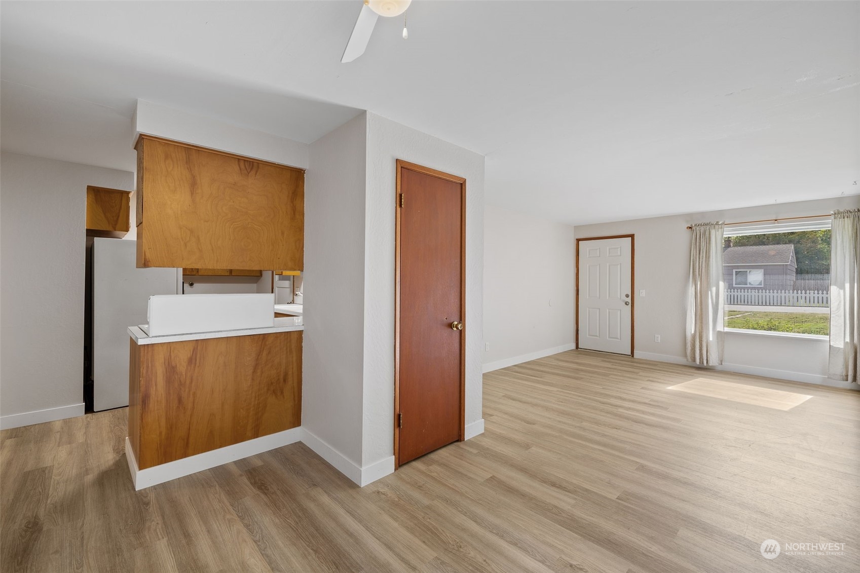 17 Fern Road Everett, WA 98203 - Photo 8 of 24 a view of an empty room with a window and wooden floor