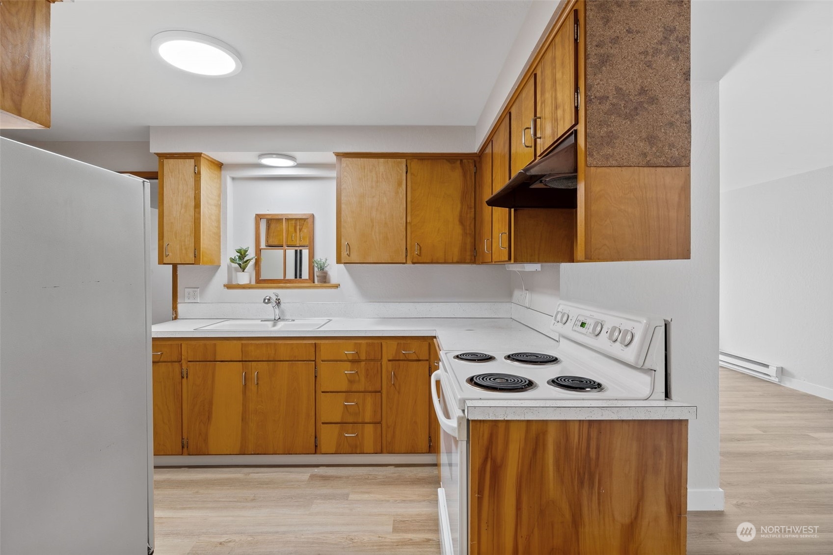17 Fern Road Everett, WA 98203 - Photo 9 of 24 a kitchen with a sink a stove and cabinets