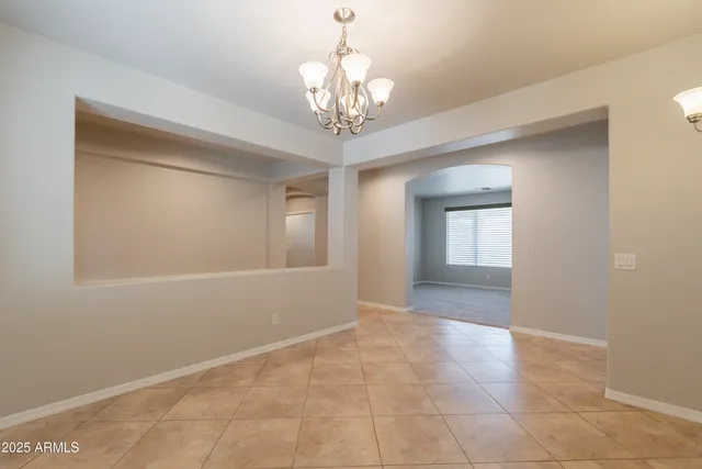 a large kitchen with stainless steel appliances granite countertop wooden cabinets a granite counter tops and a window