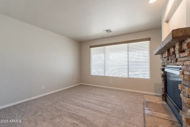 a large kitchen with a large counter top stainless steel appliances and cabinets