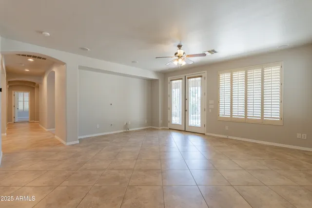 a view of an empty room with a fan