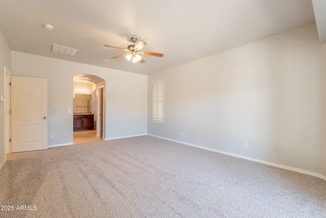 a kitchen with granite countertop cabinets and utility room