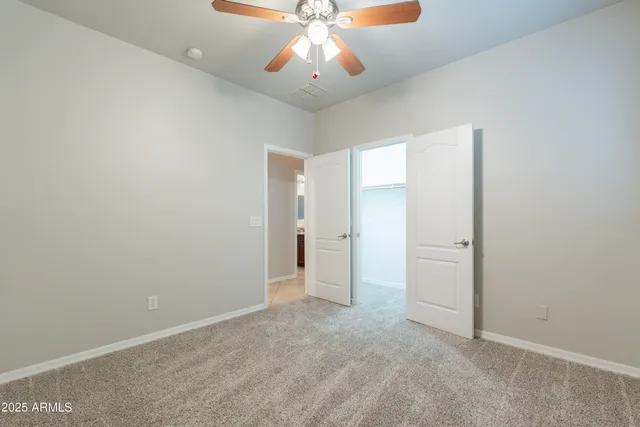a view of a patio with table and chairs and potted plants