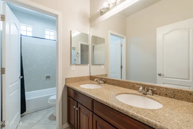 a view of a backyard with table and chairs plants and palm tree