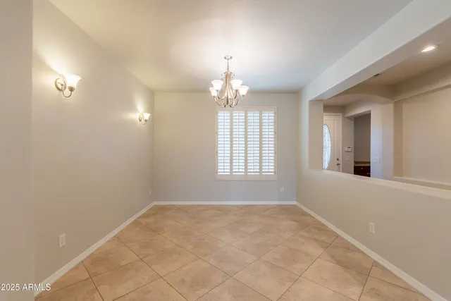a living room with a fireplace and a window