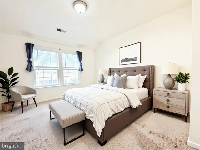 a bedroom with a bed and window