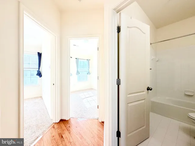 a view of an empty room with windows