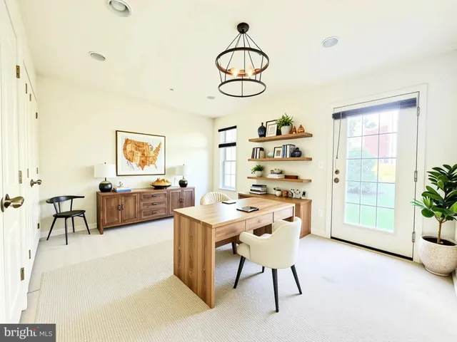 a view of a workspace with furniture