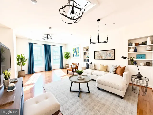 a living room with furniture a rug and white walls
