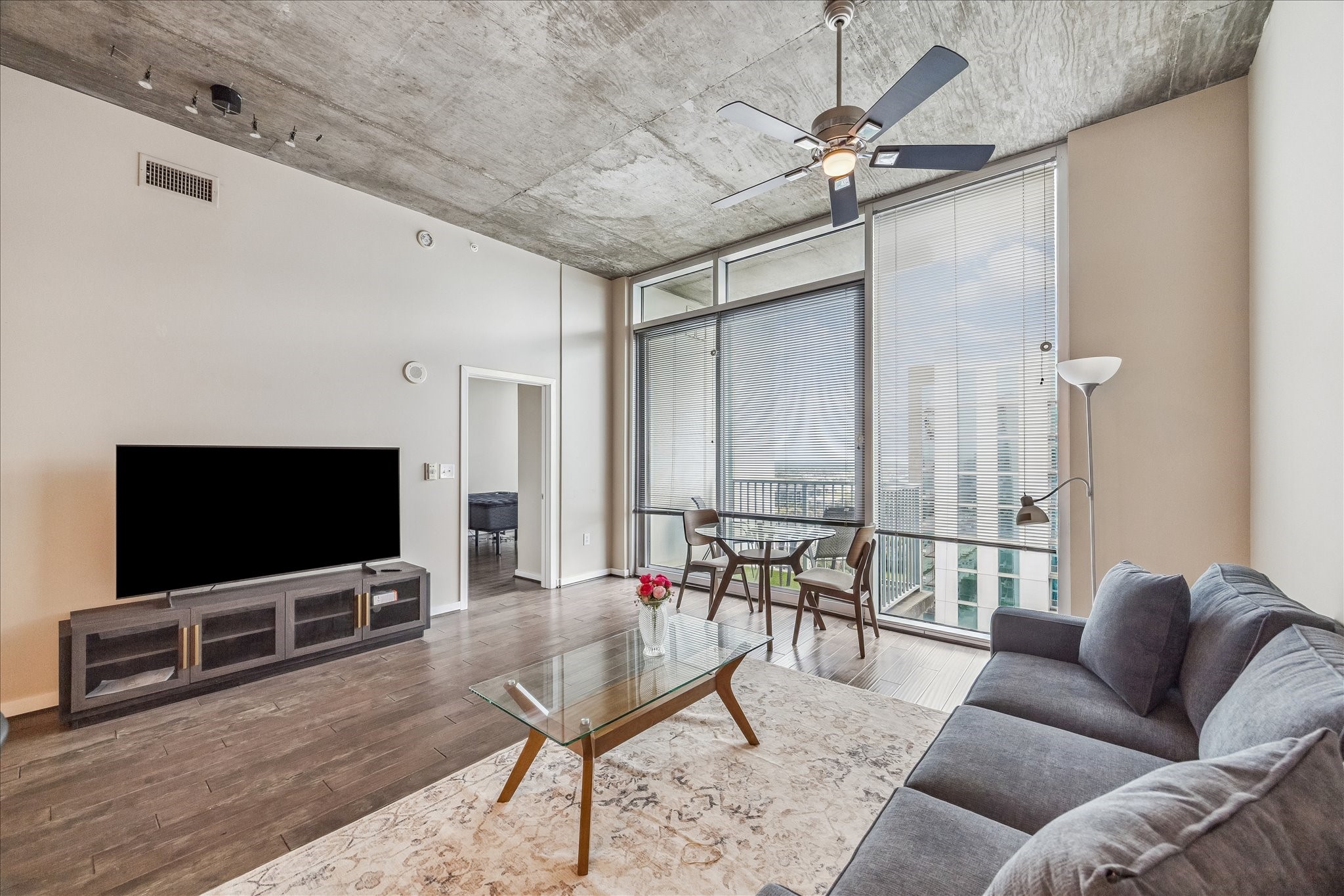 5925 Almeda Road, Unit 12704 Houston, TX 77004 - Photo 6 of 31 Enjoy panoramic views from nearly every angle in this light-filled living space. The open layout provides flexibility for entertaining while maintaining a warm and inviting atmosphere high above the city.