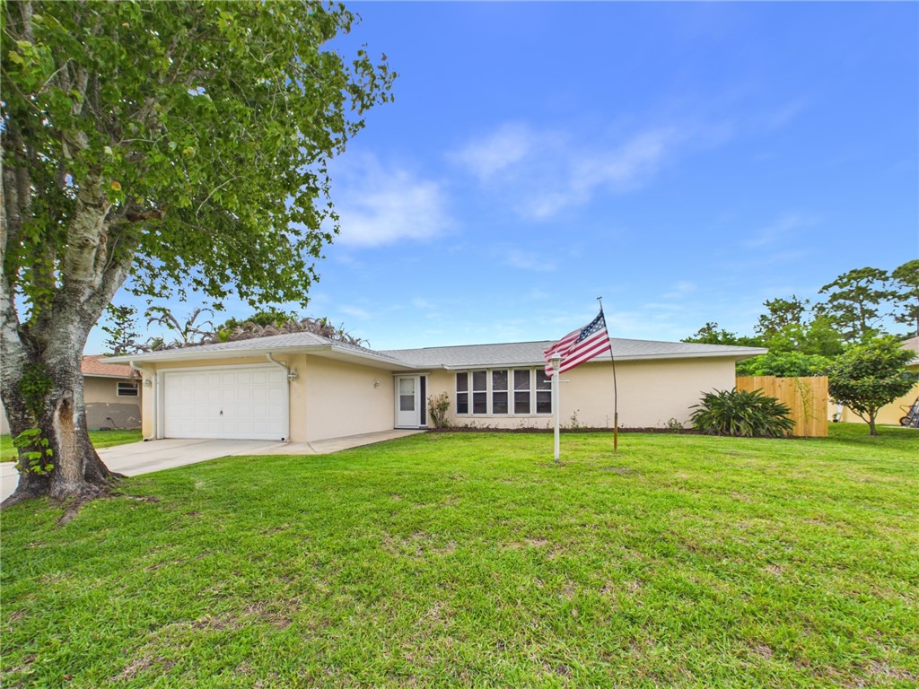 225 Midvale Terrace Sebastian, FL 32958 - Photo 1 of 25 a view of a house with a yard and sitting area
