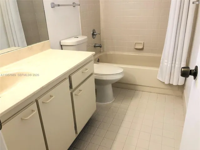 a bathroom with a sink a toilet and a bathtub