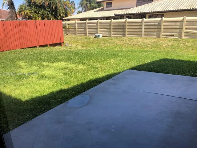 a view of a backyard with plants
