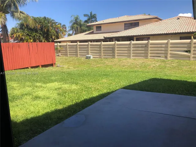 a front view of house with yard and outdoor seating