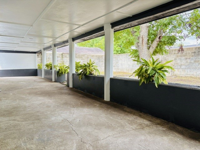 3726 Heatherbrook Drive Houston, TX 77045 - Photo 15 of 17 a view of a room with furniture and a potted plant