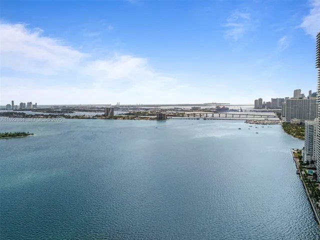 a view of a lake with a city