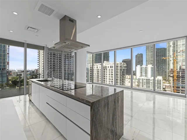 a large kitchen with a large window