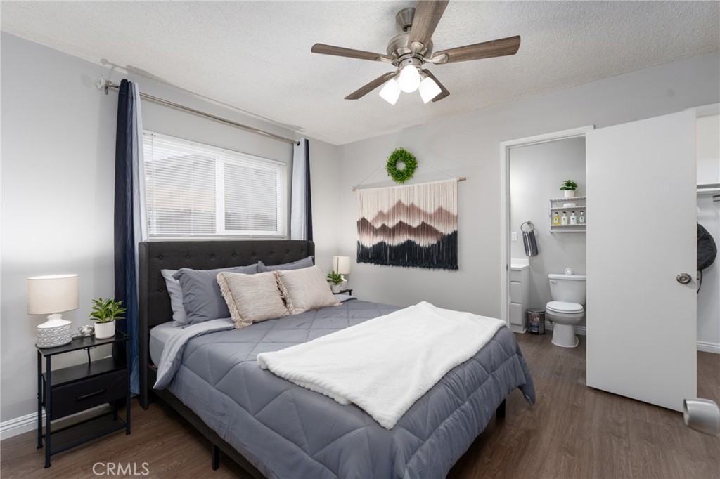 716 Orange Street Riverside, CA 92501 - Photo 13 of 28 a bedroom with a bed and a chandelier