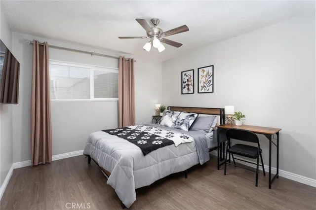 a bedroom with a bed and a table