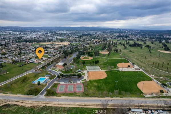 an aerial view of a house with outdoor space