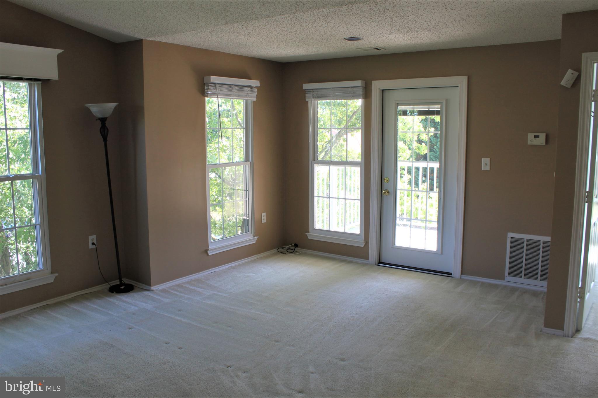 20952 Timber Ridge Terrace, Unit 302 Ashburn, VA 20147 - Photo 8 of 13 Family/Dining to Deck