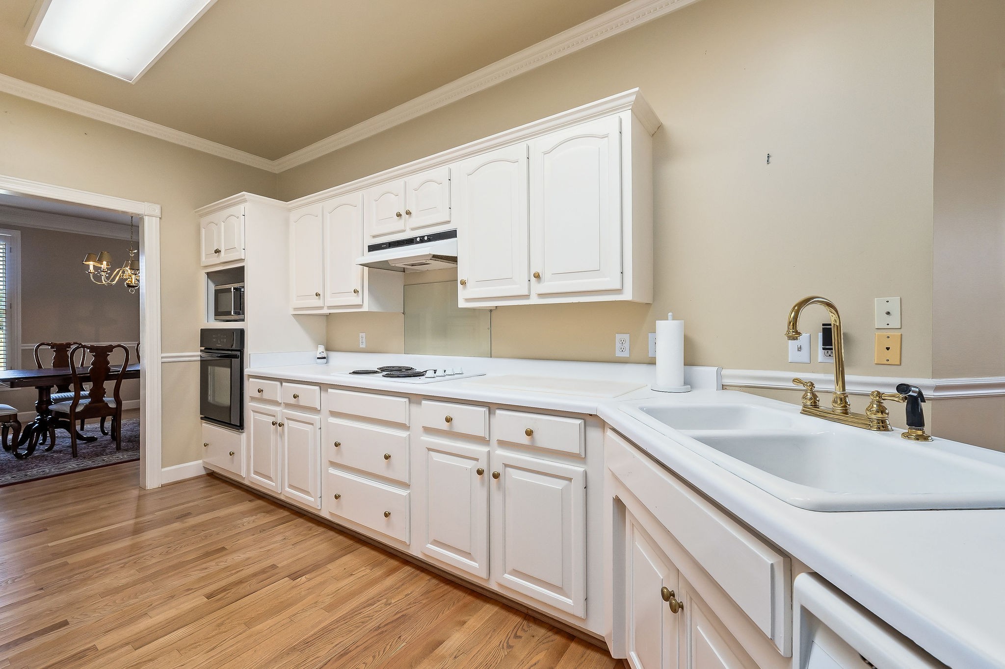 328 Riley Avenue Smithville, TN 37166 - Photo 11 of 40 a kitchen with sink cabinets and wooden floor