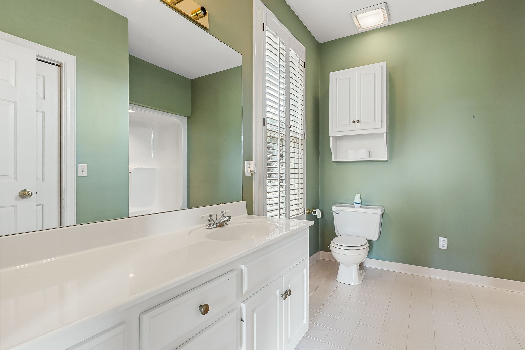 328 Riley Avenue Smithville, TN 37166 - Photo 22 of 40 a bathroom with a sink a toilet and a mirror