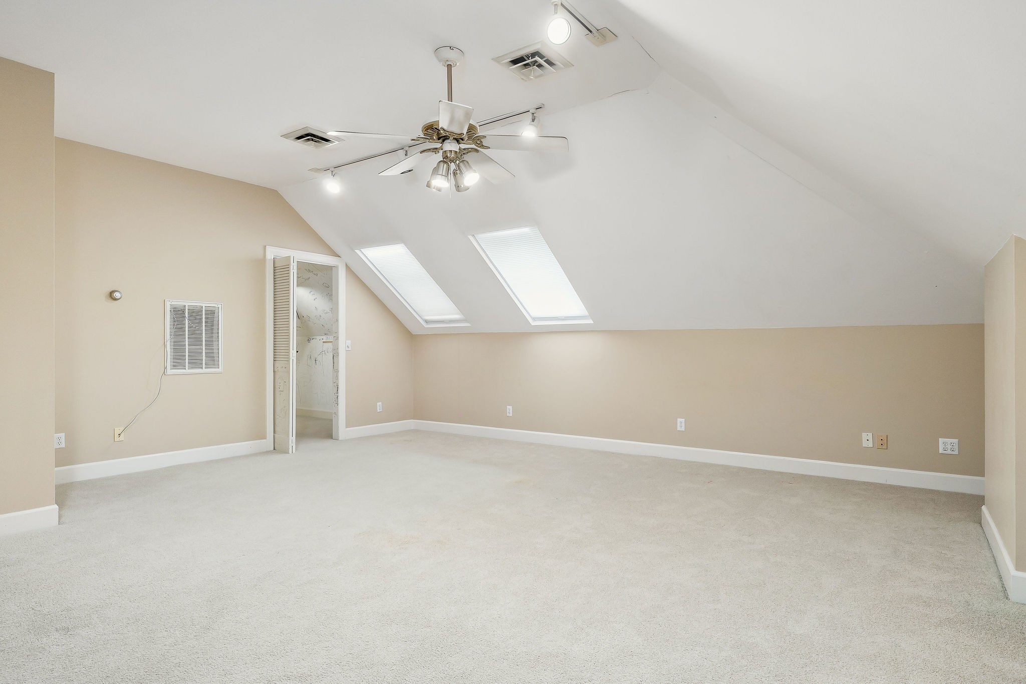 328 Riley Avenue Smithville, TN 37166 - Photo 28 of 40 an empty room with chandelier fan and windows