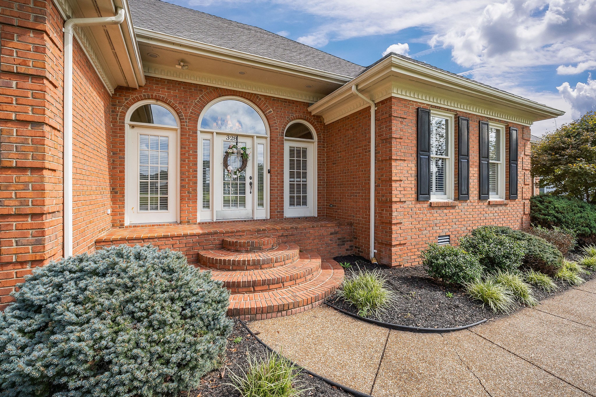 328 Riley Avenue Smithville, TN 37166 - Photo 34 of 40 a front view of a house with garden