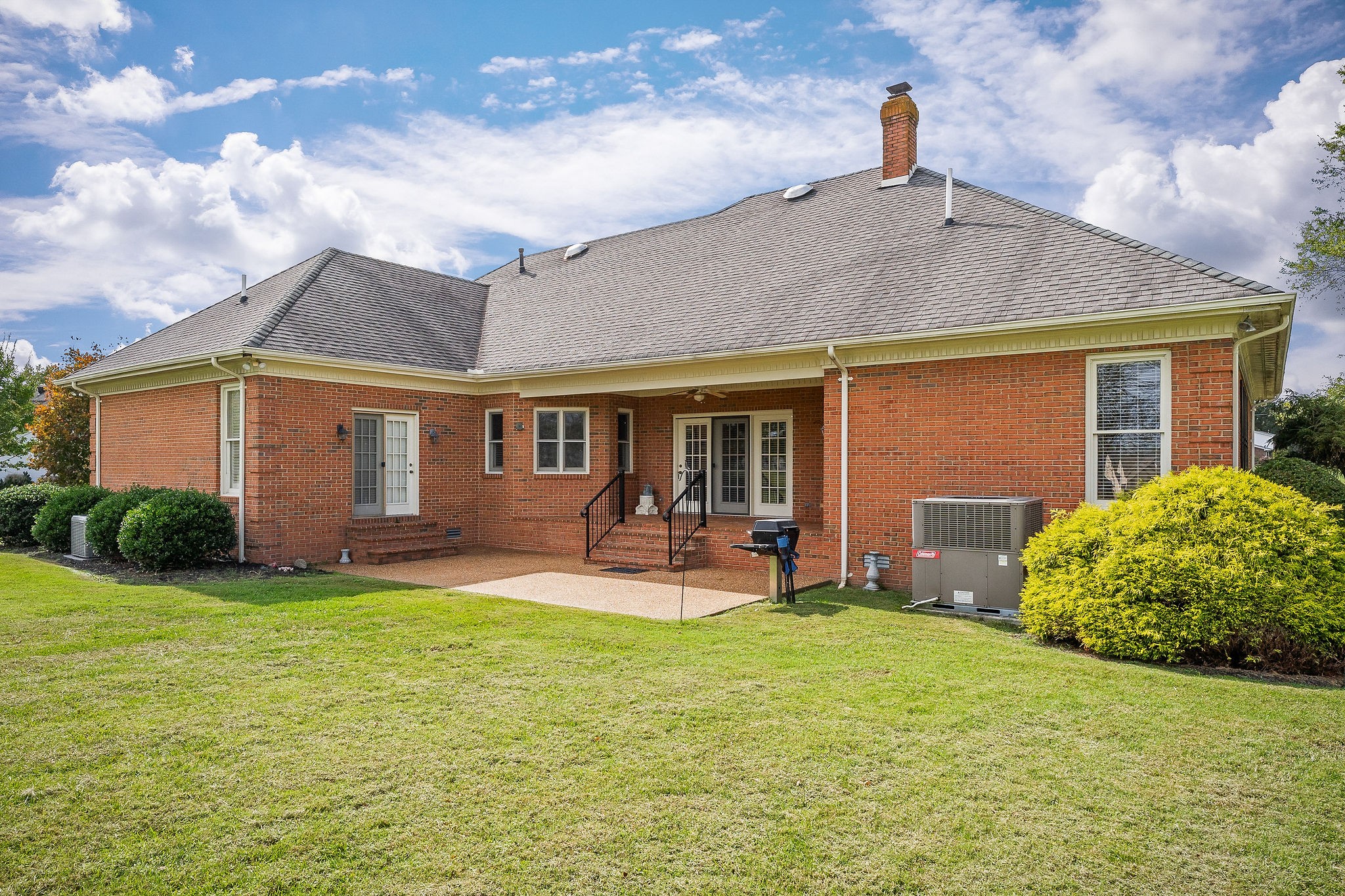 328 Riley Avenue Smithville, TN 37166 - Photo 37 of 40 a front view of a house with garden and porch