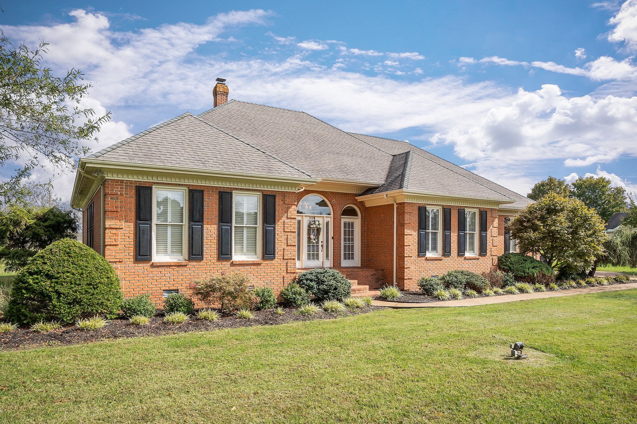 328 Riley Avenue Smithville, TN 37166 - Photo 40 of 40 a front view of a house with a yard