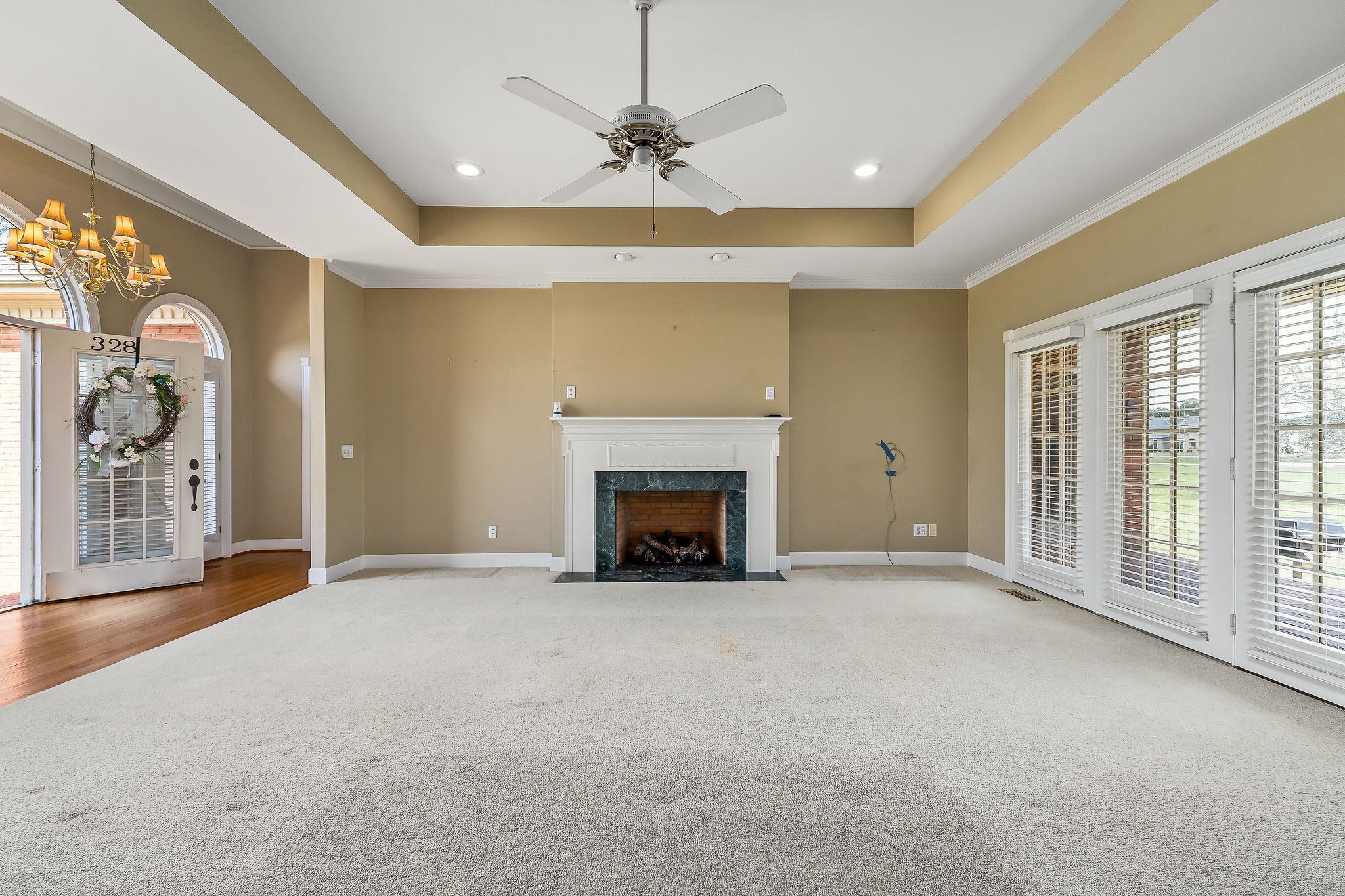 328 Riley Avenue Smithville, TN 37166 - Photo 4 of 40 a view of an empty room with a fireplace and a window