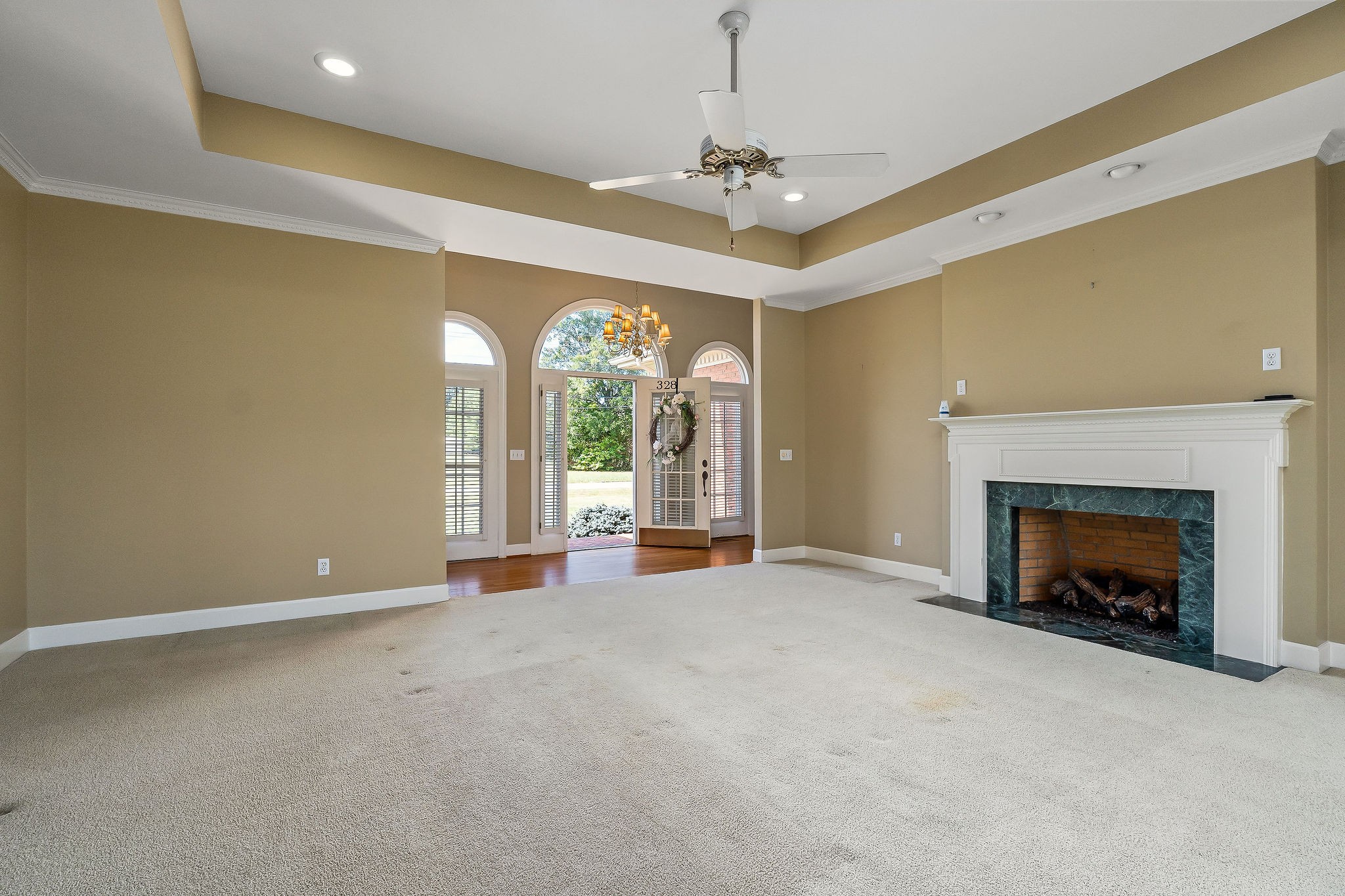 328 Riley Avenue Smithville, TN 37166 - Photo 5 of 40 a view of an empty room with a fireplace and a window