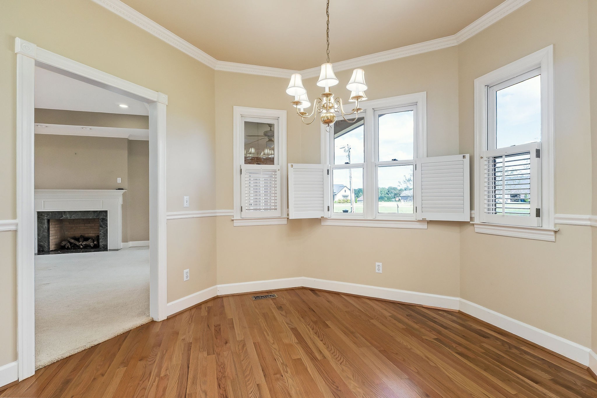 328 Riley Avenue Smithville, TN 37166 - Photo 7 of 40 a view of an empty room with wooden floor and a window