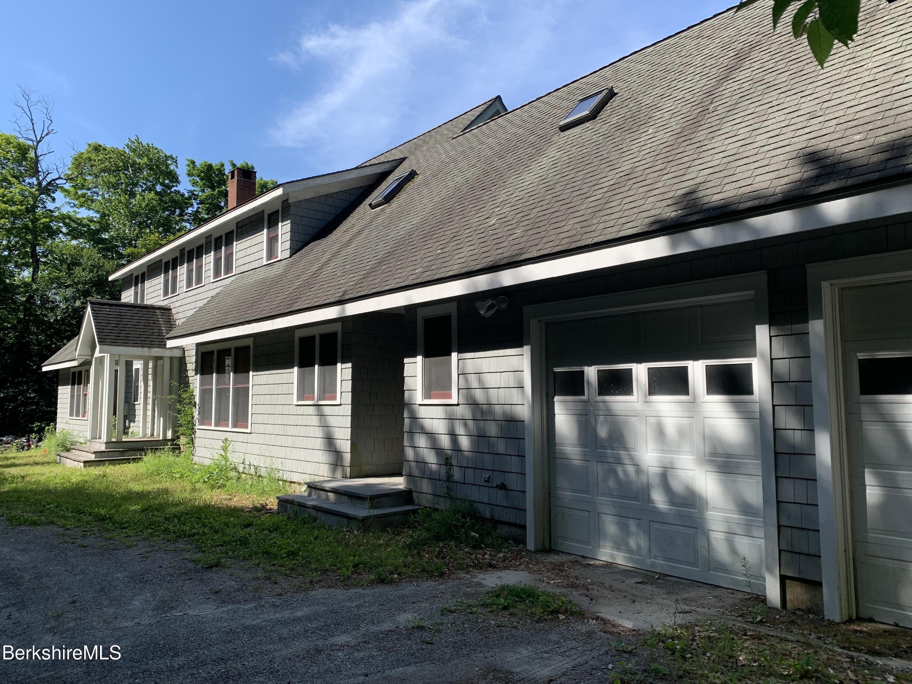 325 Cross Place Road Washington, MA 01223 - Photo 3 of 61 a front view of a house with a yard