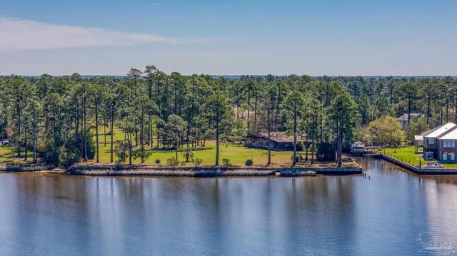 a view of swimming pool with seating area and hardwood