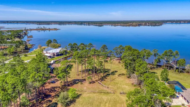a view of a large body of water with a building in the background