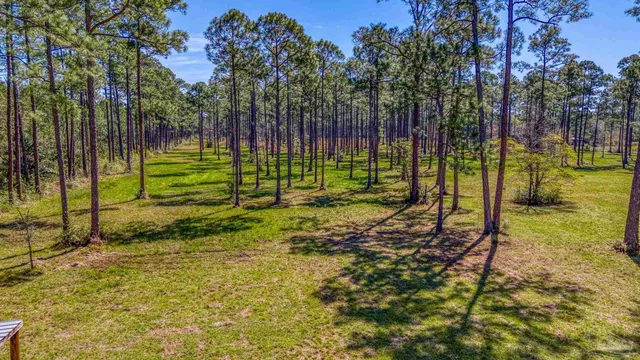 a view of swimming pool with an outdoor space and seating area