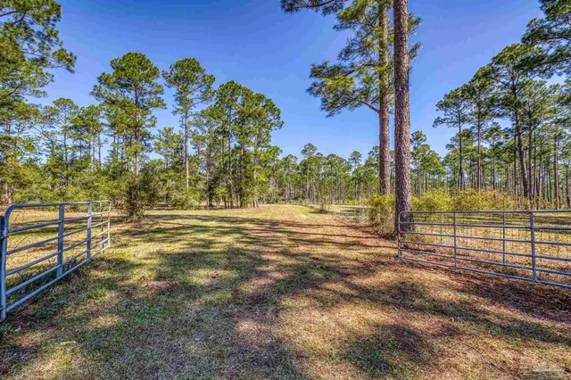 a view of a garage with wooden table and chairs