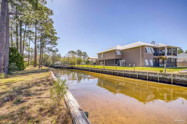 a view of dirt yard with a trees