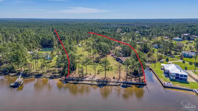 view of a lake with a big yard