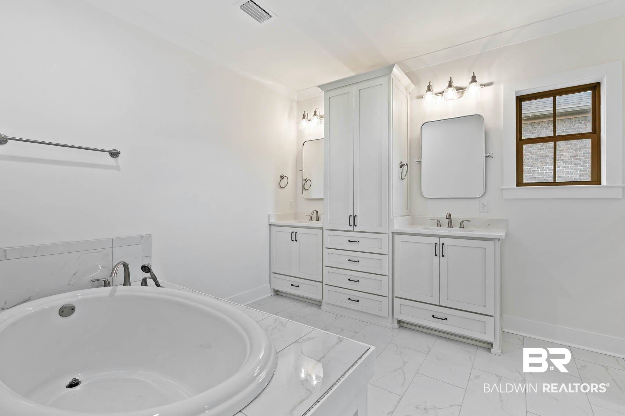 6656 Garrison Drive Daphne, AL 36527 - Photo 28 of 57 Full bathroom featuring vanity, a bathtub, and light marble finish floors