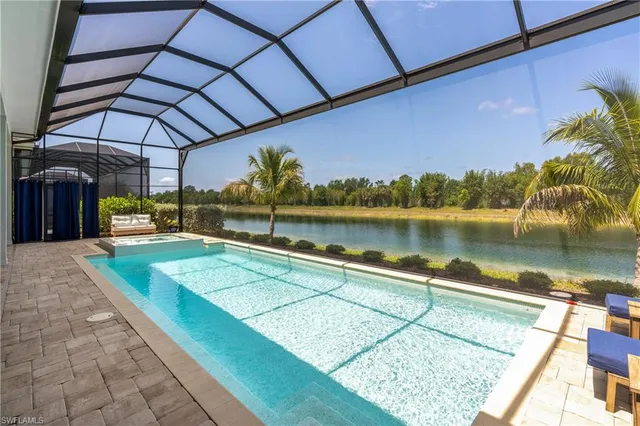 a view of a backyard with sitting area