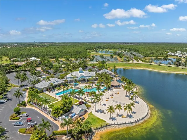 an aerial view of a house with a lake view